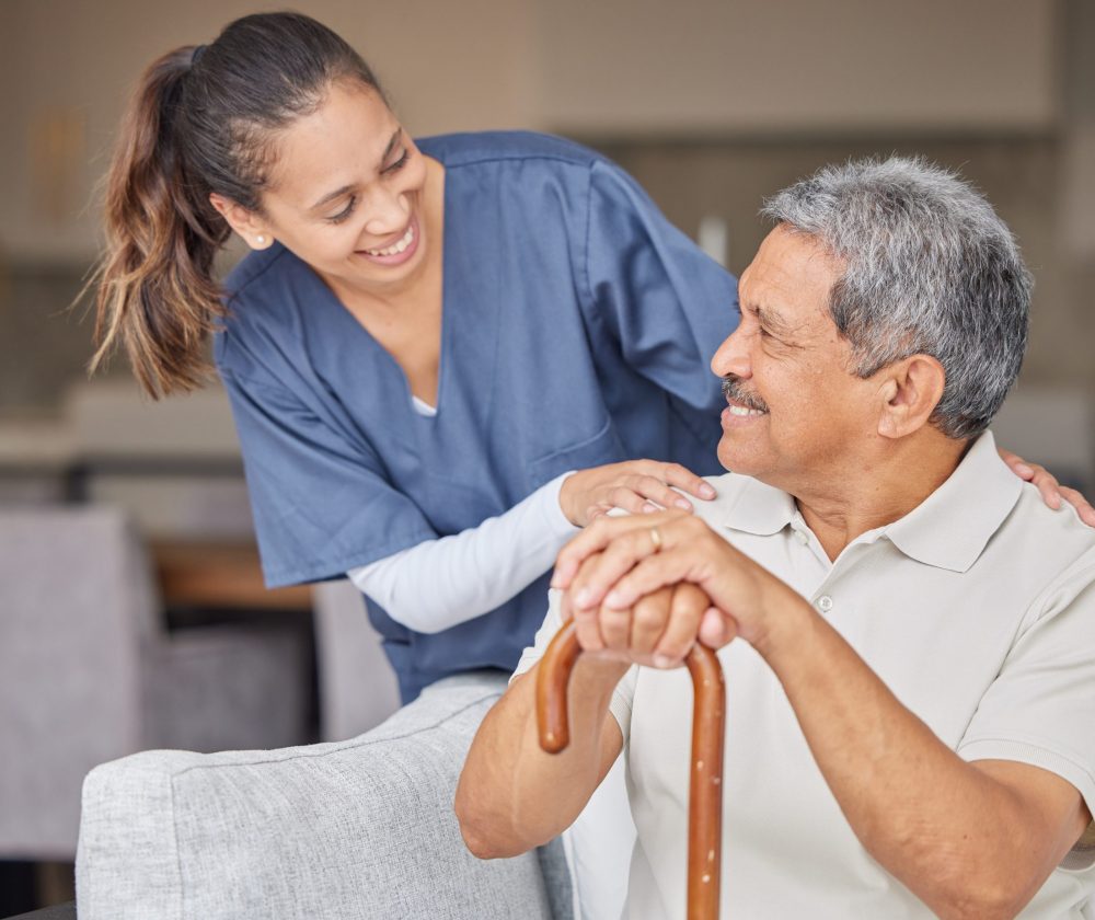 Healthcare, kindness and support with nurse helping elderly patient in assisted living home, smile .